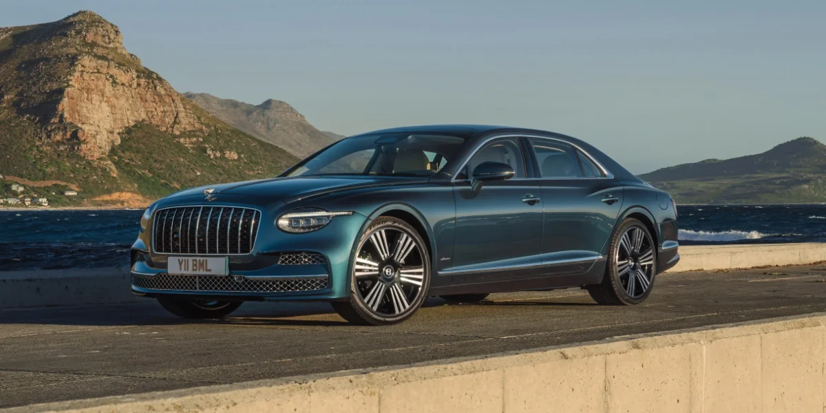 2027 Bentley Flying Spur parked in front of a modern luxury home in Rancho Mirage, California.